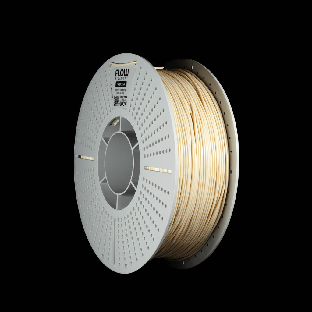 A spool of 3D printing filament wound on a white perforated spool, shown against a solid black background. The filament itself is a beigh color.