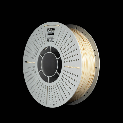 A spool of FLOW 3D PLA filament in a warm beige color, mounted on a white perforated spool, shown against a solid black background.