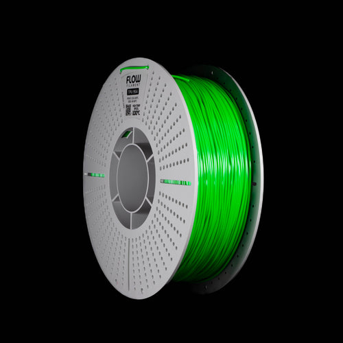 A spool of emerald green 3D printer filament wound on a white perforated spool, shown against a solid black background.