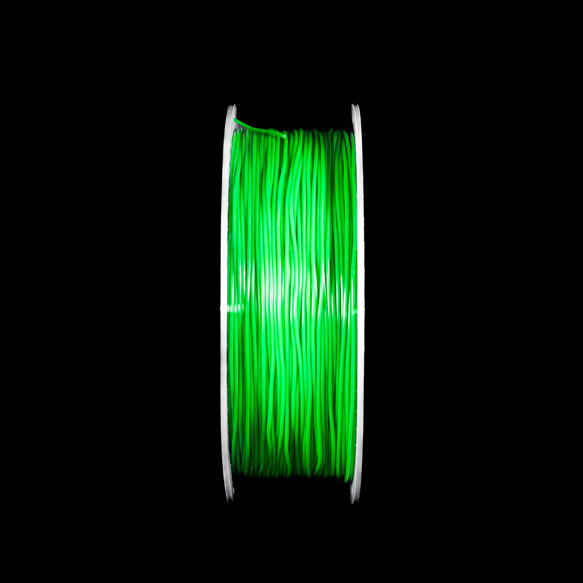 A spool of emerald green 3D printing filament centered against a solid black background.