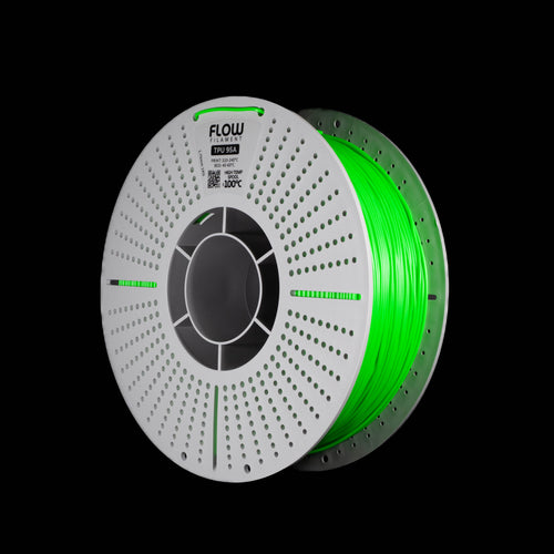 A spool of fluorescent bright green 3D printing filament on a black background, with the FLOW brand name visible on the top of the spool.