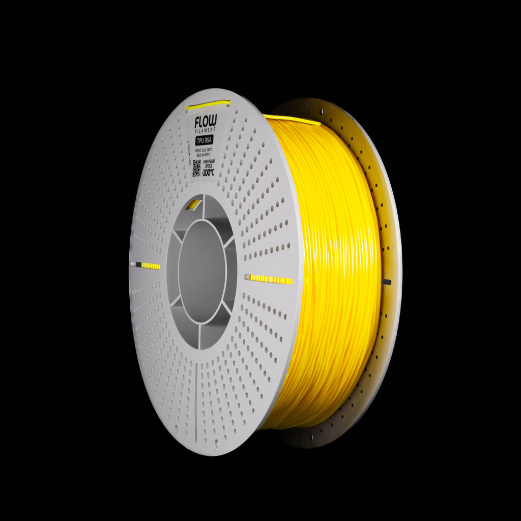 A spool of fluoscent bright yellow 3D printing filament wound on a white perforateed spool, shown against a solid black background. The brand name 'LOW' is visible on the top of the spool.