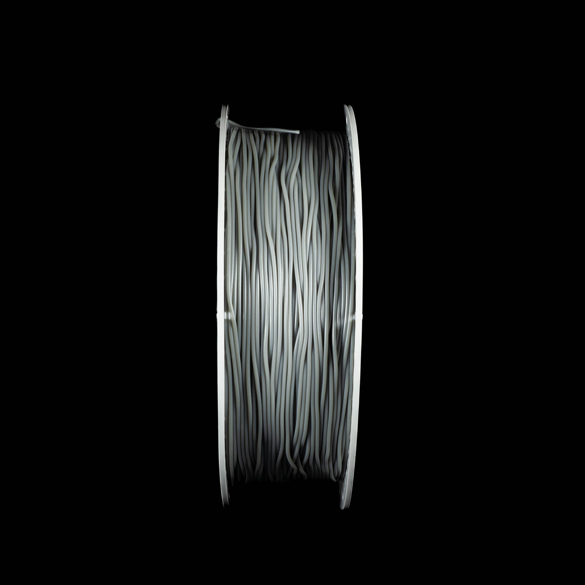 A spool of grey coloured 3D printing filament wound tightly, shown from a front-facing perspective against a solid black background.