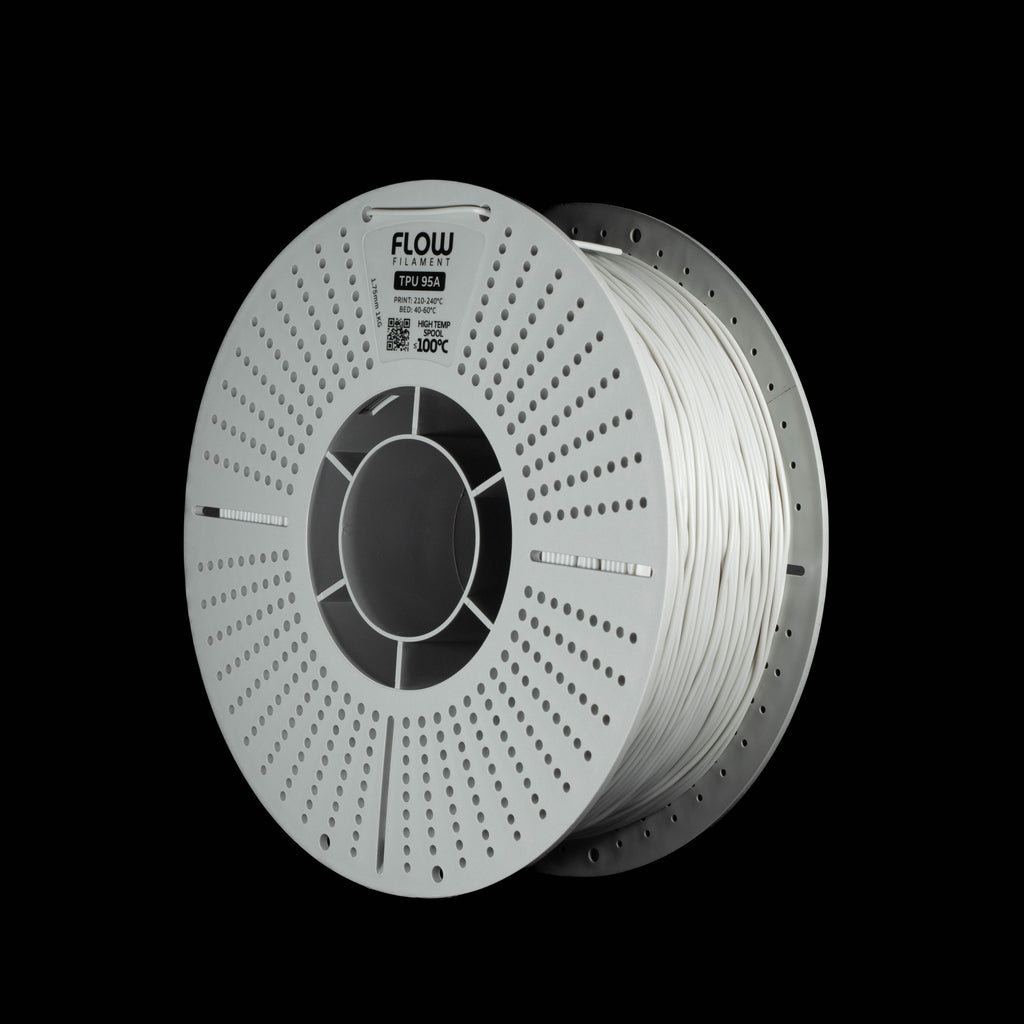 A spool of light grey 3D printing filament on a black background, featuring the FLOW brand logo printed on the top of a perforated spool.