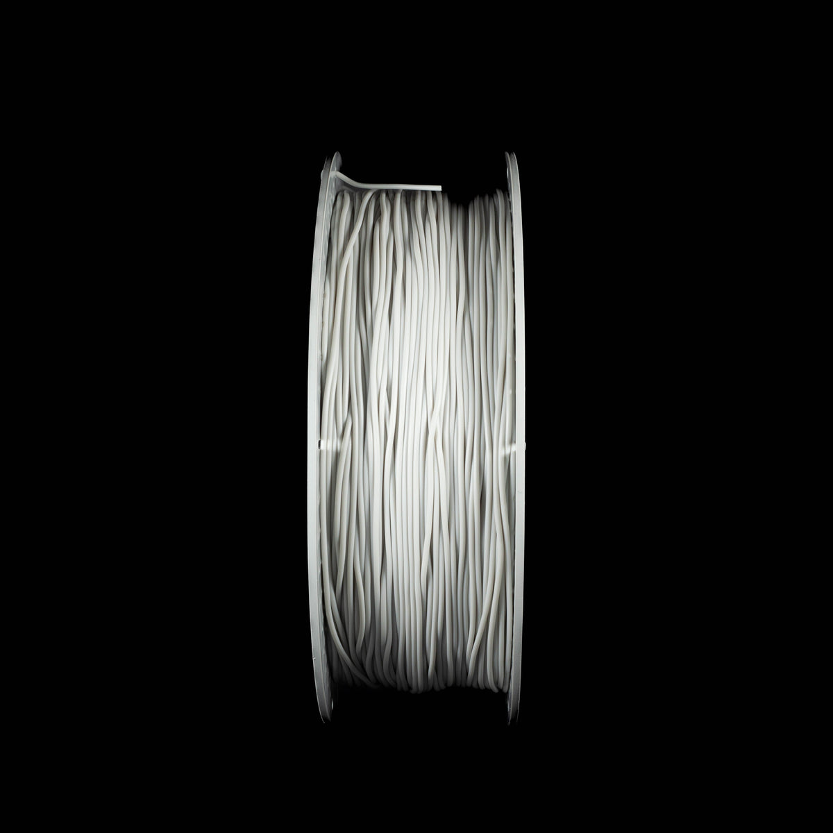 A spool of light gray 3D printing filament, centered against a solid black background.
