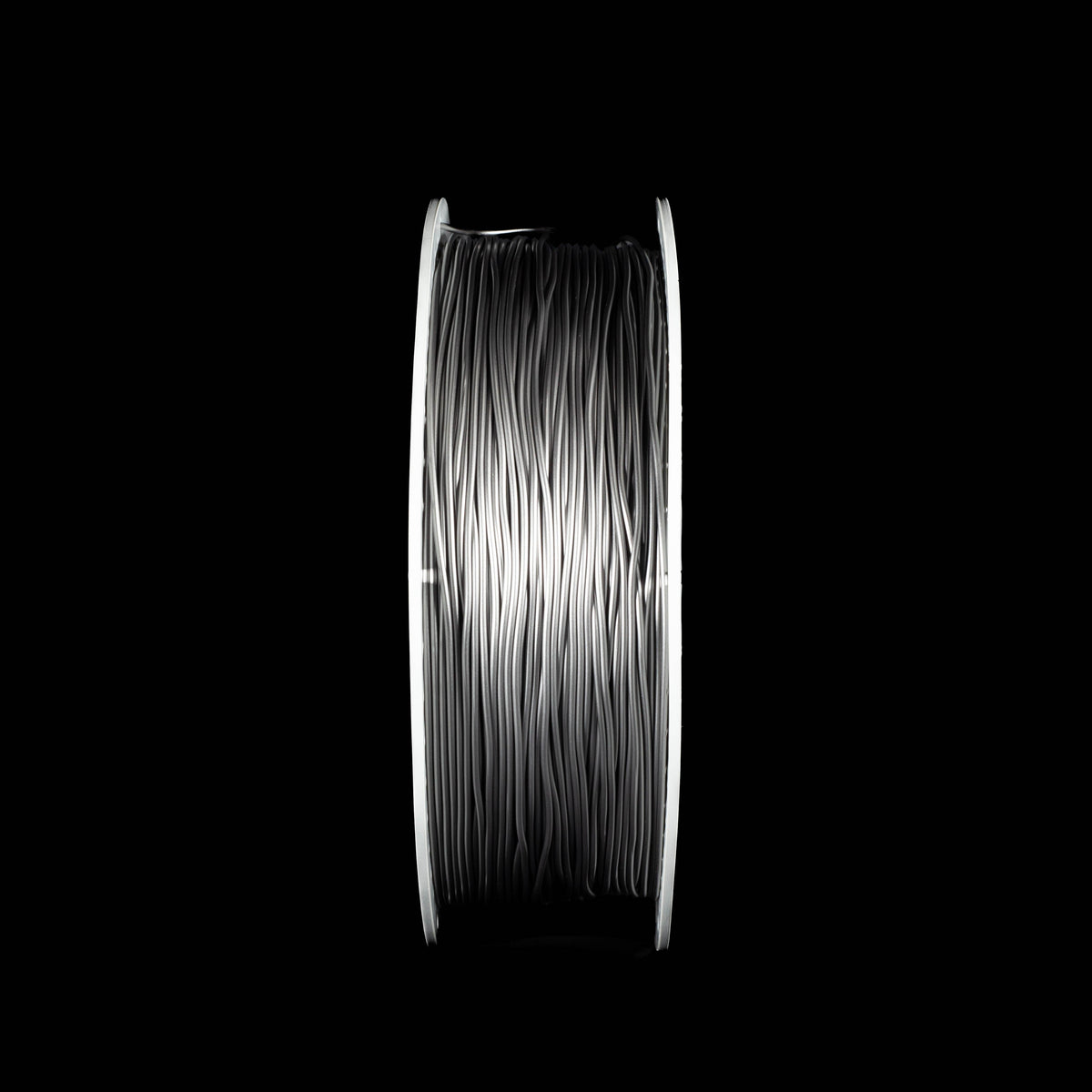 A spool of metallic space grey 3D printing filament on a solid black background.
