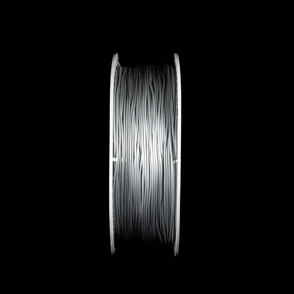 A spool of metallic silver 3D printing filament, shown vertically against a solid black background.