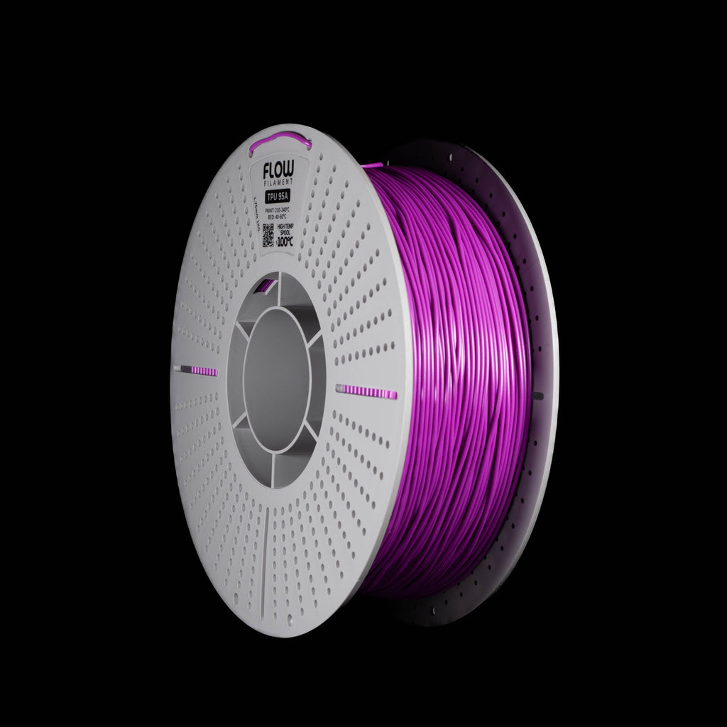 A spool of purple 3D printing filament on a black background, with the brand name FLOW visible on the top of the spool.