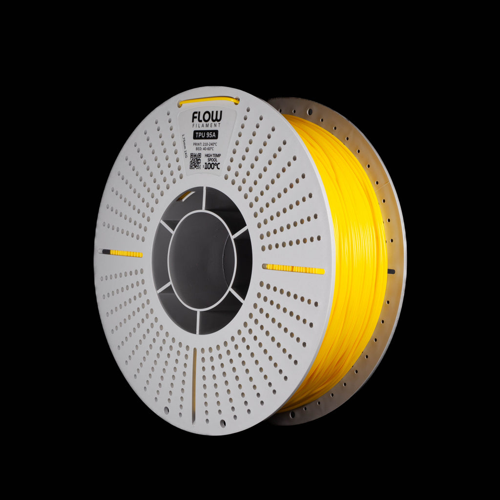 A spool of fluorescent yellow 3D printing filament on a black background, featuring a white perforated spool and a visible FLOW brand label.