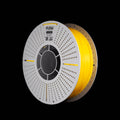 A spool of fluorescent yellow 3D printing filament on a black background, featuring a white perforated spool and a visible FLOW brand label.