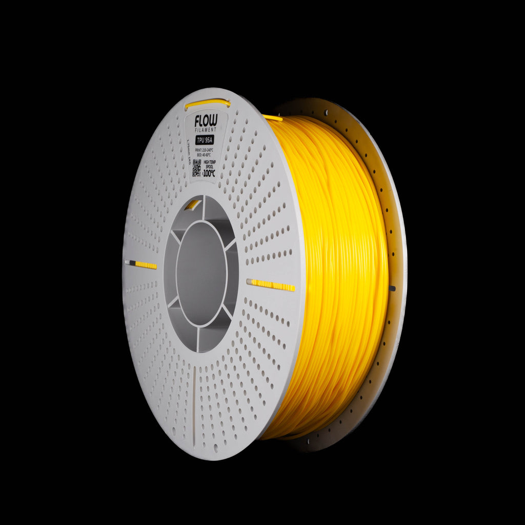 A spool of fluorescent bright yellow 3D printing filament on a white plastic perforated spool with the brand name 'FLOW', shown against a solid black background. 