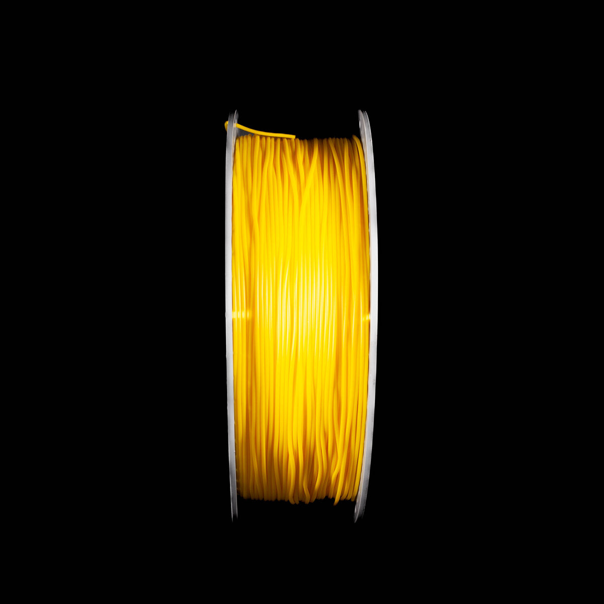 A spool of fluorescent bright yellow 3D printing filament, shown vertically against a solid black background.