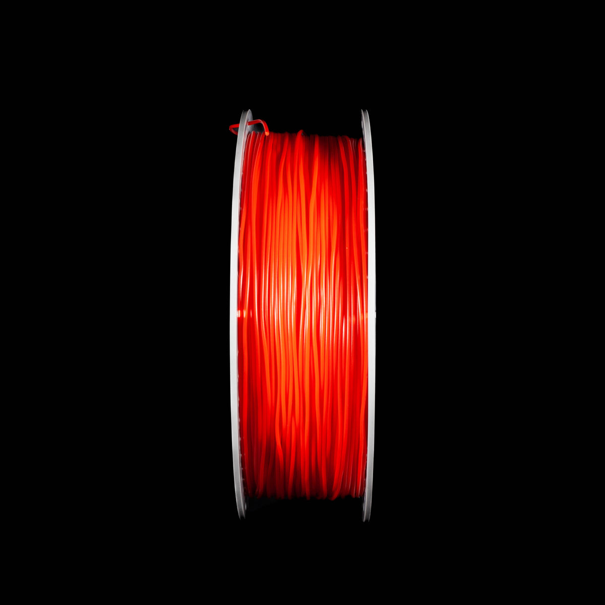 A spool of fluorescent bright red 3D printing filament centered against a solid black background.