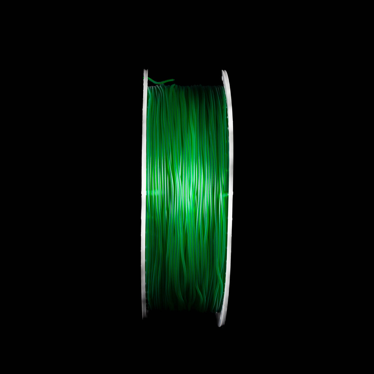 A spool of 3D printing filament in translucent emerald green on a black background.