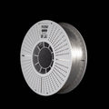 A spool of transparent filament on a white perforated spool, branded 'FLOW', shown on a solid black background.