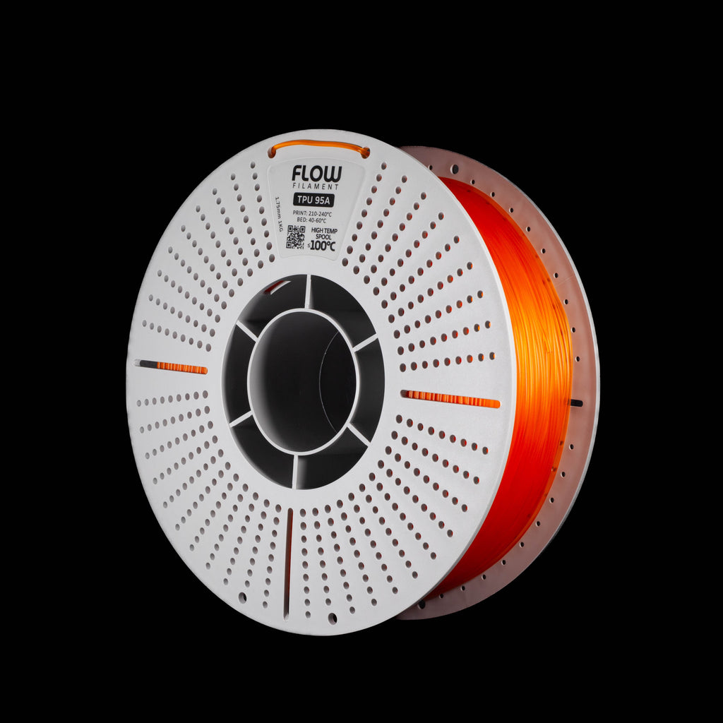 A spool of 3D printer filament in translucent orange colour on a black background, with the brand name FLOW visible on the top of the spool.