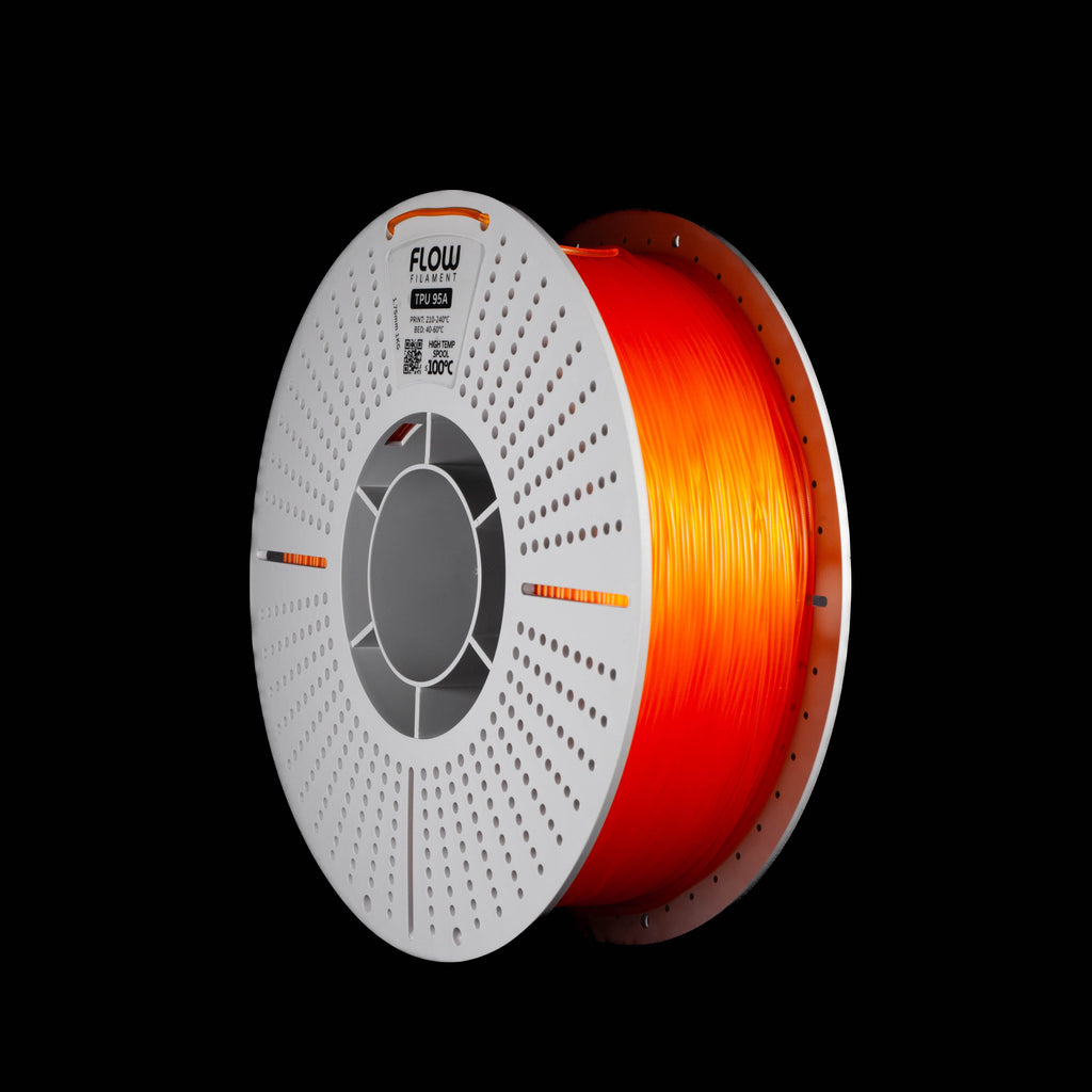 A spool of 3D printer filament in translucent orange colour on a black background, with the brand name FLOW visible on the top of the spool.