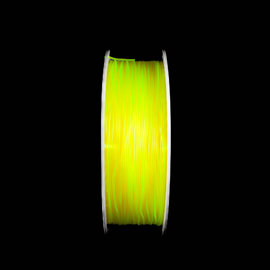 A spool of translucent yellow 3D printing filament, centered against a solid black background.